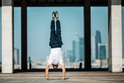 How to Handstand | Train to Balance on Your Hands - Health & Fitness